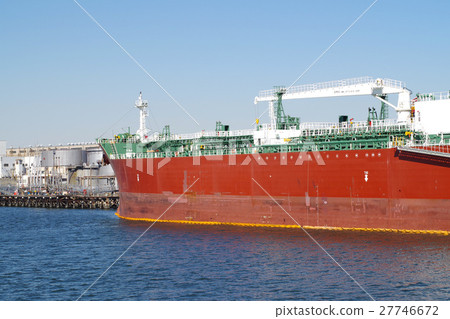 A red ship at Kawasaki Port that handles cargo A red ship at Kawasaki Port that handles cargo 27746672