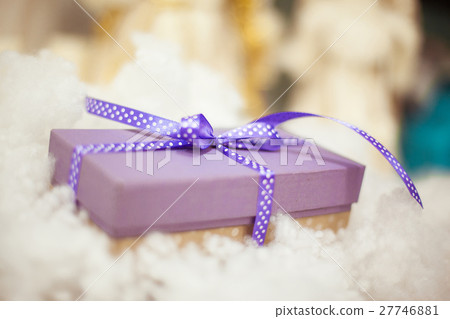 purple gift boxes with satin ribbons  27746881