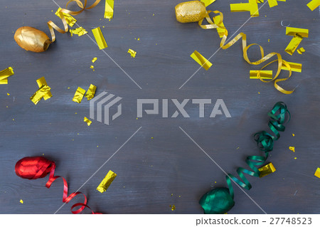 Masquerade decorations on dark wooden background Masquerade decorations on dark wooden background 27748523