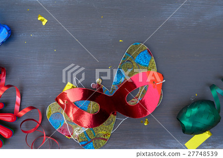 Masquerade decorations on dark wooden background Masquerade decorations on dark wooden background 27748539