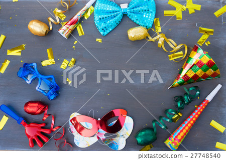 Masquerade decorations on dark wooden background Masquerade decorations on dark wooden background 27748540