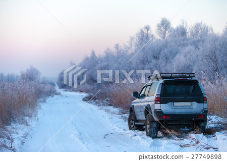 Mitsubishi Pajero Sport on a winrer road 27749898