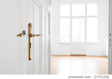 open door, empty room in renovated old flat 27751292