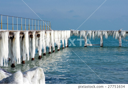 Frozen fishing pier with hanging icicles Frozen fishing pier with hanging icicles 27751634