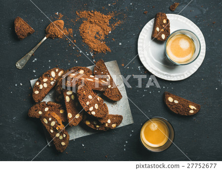 Biscotti with sea salt and almonds, two glasses of Biscotti with sea salt and almonds, two glasses of 27752677