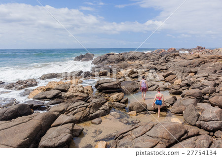 Girl Boy Walking Beach Rocks Ocean Girl Boy Walking Beach Rocks Ocean 27754134