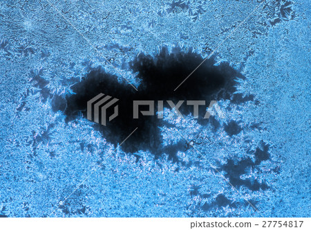Ice patterns on glass. winter background Ice patterns on glass. winter background 27754817