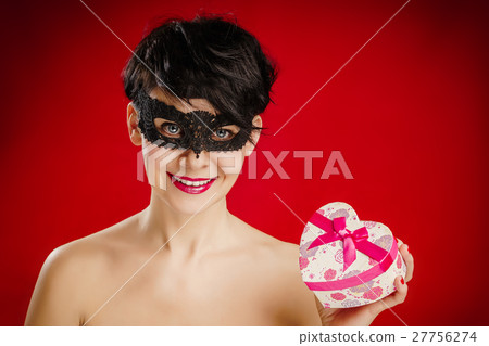 woman in a mask with a gift 27756274