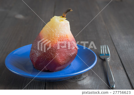 poached pear on blue plate and fork poached pear on blue plate and fork 27756623