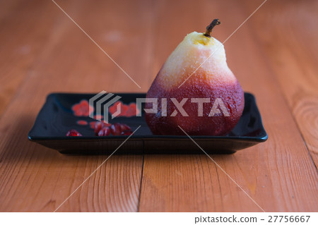 poached pear on black rectangle plate 27756667