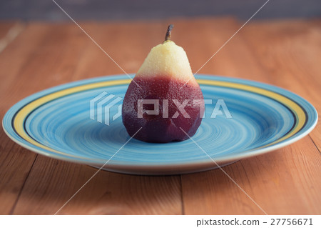 poached pear on blue plate poached pear on blue plate 27756671