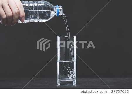 PET bottle water and glass, dark background PET bottle water and glass, dark background 27757035