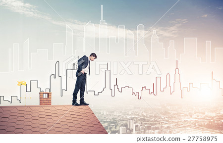 Businessman looking down from roof and modern cityscape at backg 27758975