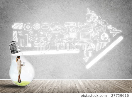 Businesswoman trapped in bulb Businesswoman trapped in bulb 27759616