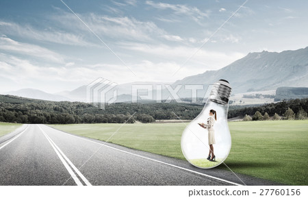 Businesswoman inside light bulb 27760156
