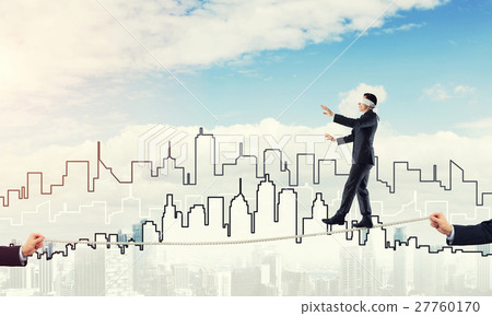 Business concept of risk support and assistance with man balancing on rope Business concept of risk support and assistance with man balancing on rope 27760170