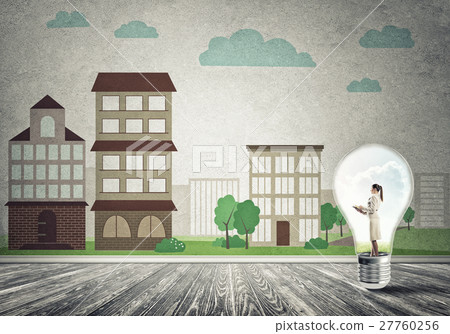 Businesswoman trapped in bulb Businesswoman trapped in bulb 27760256