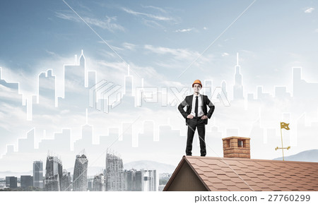 Engineer man standing on roof and looking away. Mixed media 27760299