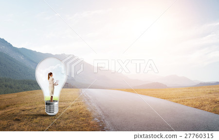 Businesswoman inside light bulb 27760315
