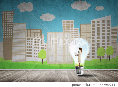 Businesswoman trapped in bulb Businesswoman trapped in bulb 27760944