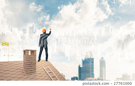 Man architect draw silhouette of modern city on blue sky. Mixed 27761000