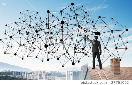 Businessman on house roof presenting networking and connection concept. Mixed media Businessman on house roof presenting networking and connection concept. Mixed media 27761002