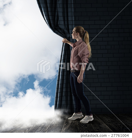 young woman pushes the curtain looking at clouds young woman pushes the curtain looking at clouds 27761004