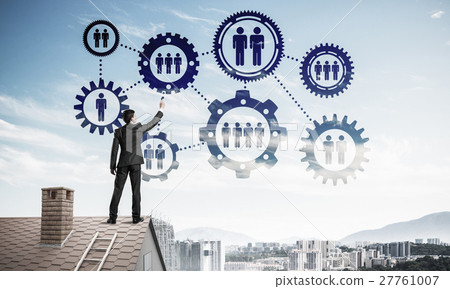 Businessman on house roof presenting teamwork and connection con Businessman on house roof presenting teamwork and connection con 27761007