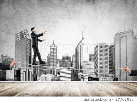 Business concept of risk support and assistance with man balancing on rope 27762053
