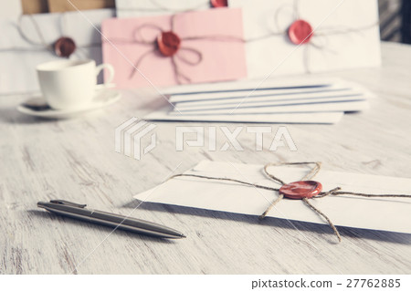 Letters with seal on table 27762885