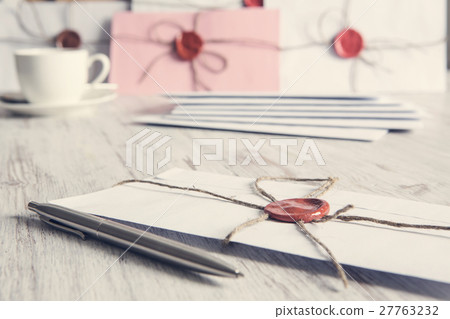 Letters with seal on table 27763232
