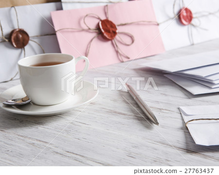Letter with seal on table 27763437