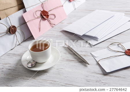 Letter with seal on table 27764642