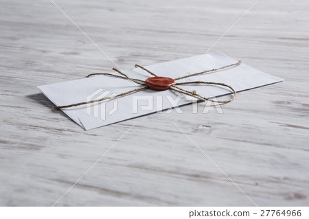 Letter with seal on table 27764966