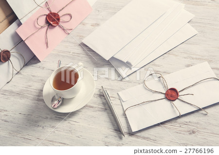 Letters with seal on table 27766196