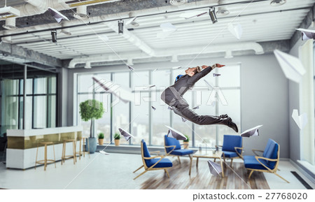Jumping businessman in office 27768020