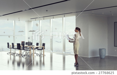 Businesswoman holding paper sheets mixed media Businesswoman holding paper sheets mixed media 27768625