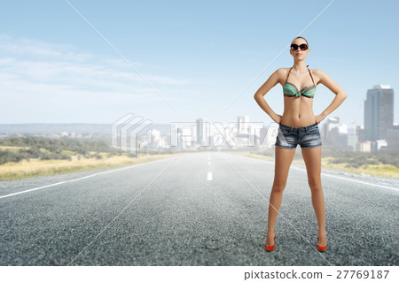 Hitch hiker woman on road 27769187