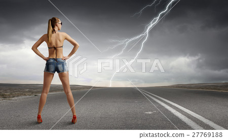 Hitch hiker woman on road 27769188