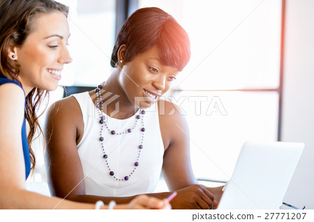 Women working together, office interior 27771207