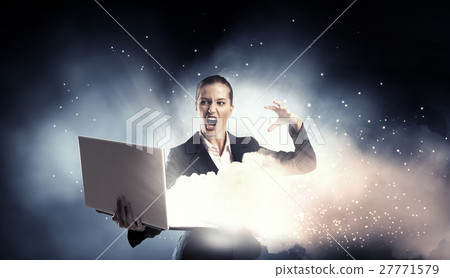 Woman with laptop in hands Woman with laptop in hands 27771579