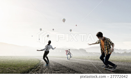 Teenagers ride skateboards Teenagers ride skateboards 27772042