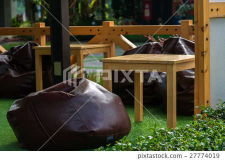 Black Ceramic tea pot and cup on Bamboo mat. Black Ceramic tea pot and cup on Bamboo mat. 27774019