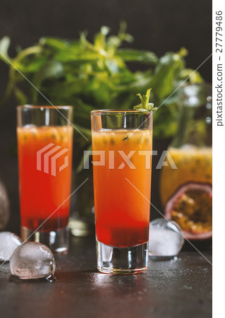 Cold cocktail with passion fruit Cold cocktail with passion fruit 27779486