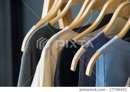 Variety of shirts hanging on the clothesline 27786932