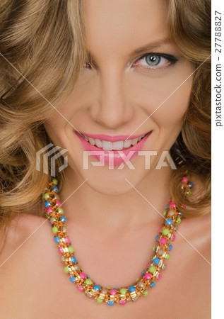 portrait of young smiling woman with necklaces portrait of young smiling woman with necklaces 27788827