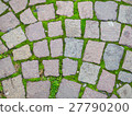 Square brick stone pattern on the street with moss 27790200