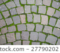 Square brick stone pattern on the street with moss 27790202