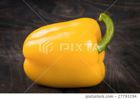 yellow sweet pepper on black wooden background 27793294
