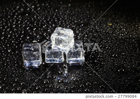 ice cubes on black background. ice cubes on black background. 27799084